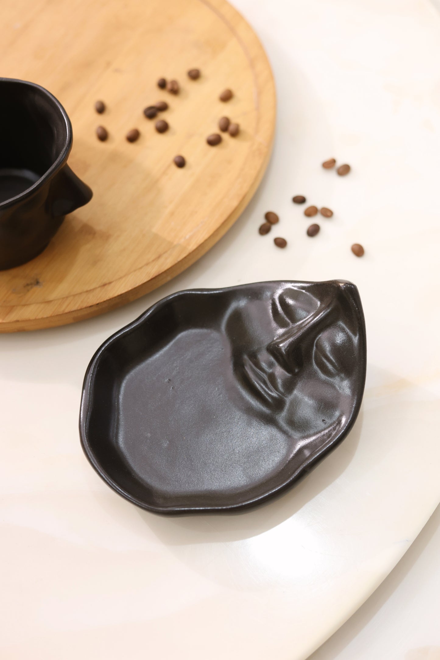 Abstract Face Cup and Saucer- Black